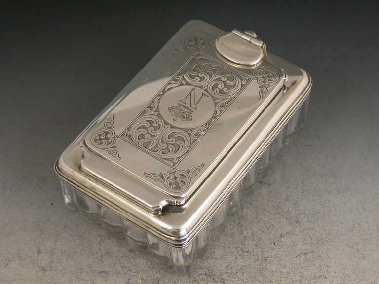 A very fine quality George IV silver mounted glass Traveling Inkwell of a large size and shaped rectangular form, the fluted glass body with a deep star-cut base, the hinged silver lid with screw down locking mechanism and interior leather seal. The
