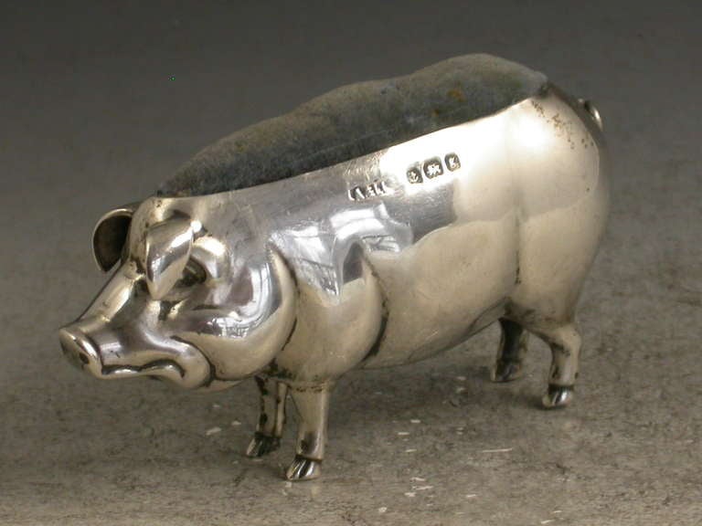 A good Edwardian novelty silver Pin Cushion made in the form of a medium size pig. 

By Adie & Lovekin, Birmingham, 1906 