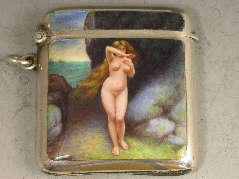 A fine quality early 20th century silver Vesta Case of curved rounded rectangular form with hinged flip-top lid and attached suspension ring. The cover with enameled scene depicting Andromeda. Probably Austrian with London import marks for Hayman &