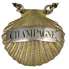 George III Parcel Gilt Scallop Shell Wine Label 'Champagne'