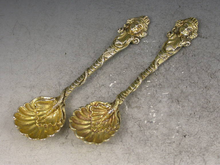 Pair of George III Cast Silver Gilt Mask Head and Serpent Salt Spoons