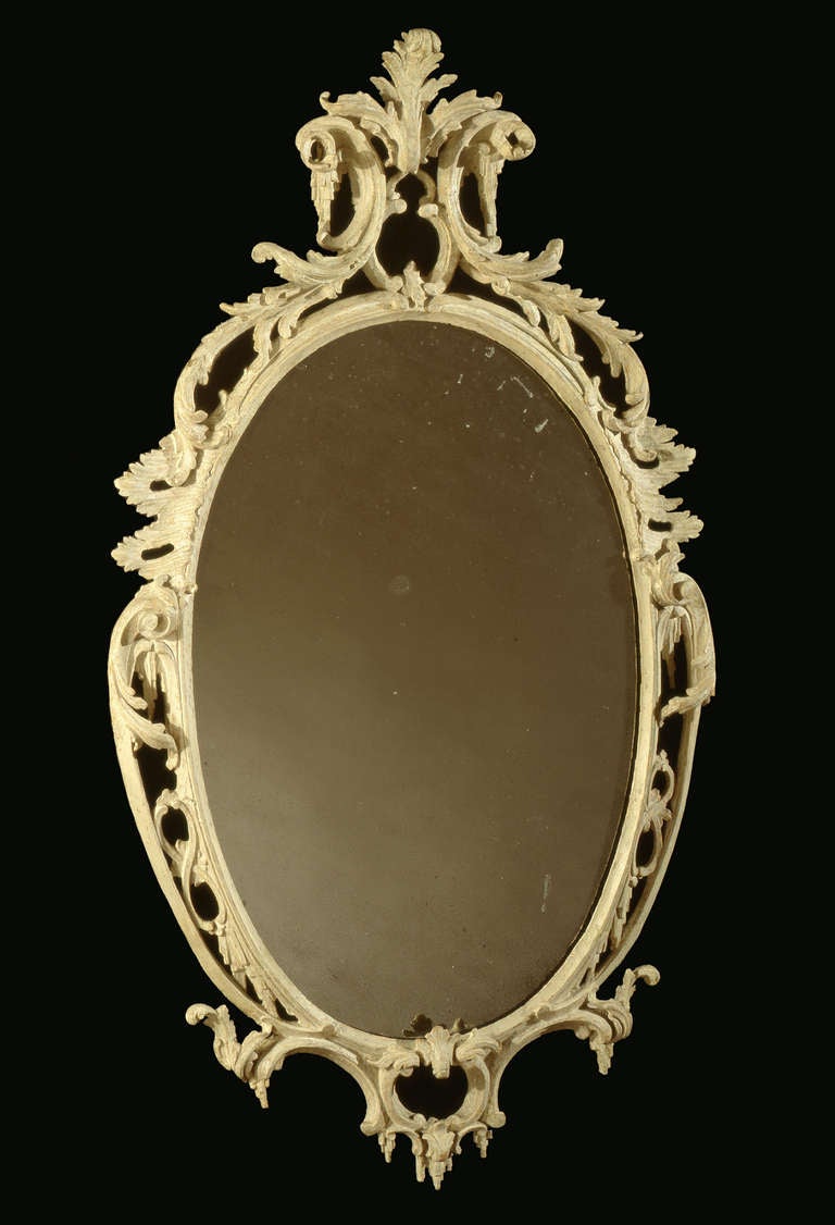 Original paint; glass early 19th century.

A substantial minority of Brithish mid-18th century carved mirrors were originally painted, not gilded. Invariably the Victorians etc over-gilded these. We have used the dry-stripping process to reveal