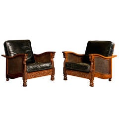 A pair of hardwood double caned Bergère chairs in new distressed leather