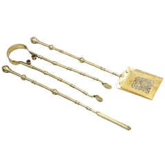 A three piece set of Antique Victorian brass fire irons