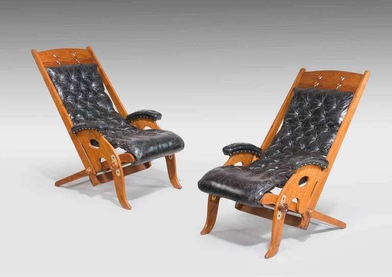 Unusual pair of adjustable Indian hard wood yacht's chairs with brass fittings