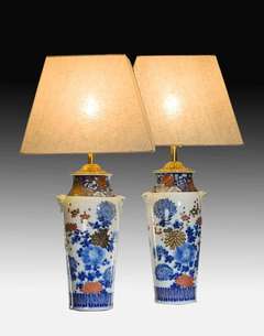 A pair of Meiji period Arita vases with overglaze polychrome