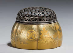 A Meiji period lobed lacquer koro with a silver basketweave cover.