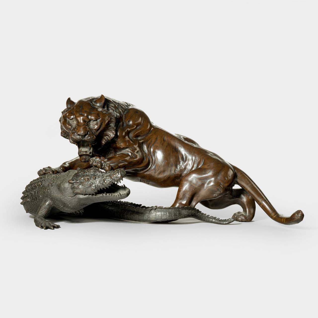 A fine Meiji bronze of a tiger and alligator, signed.