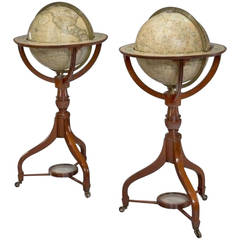 A fine pair of matched 12 inch floor standing globes by Cary