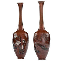 A fine pair of mixed metal vases with swimming carp