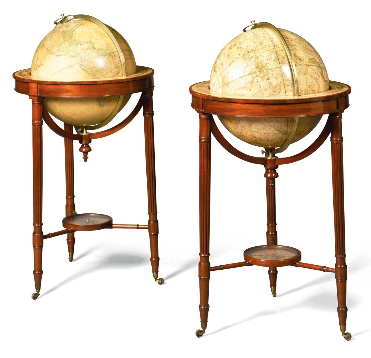 A PAIR OF REGENCY GLOBES ON MAHOGANY STANDS EARLY 19TH CENTURY, BY W & T M BARDIN 

The terrestrial globe inscribed `To the Rt. Honorable/ Sir Joseph Banks, BARt. K.B./President of the Royal Society/ This New British Terrestrial Globe/ Containing