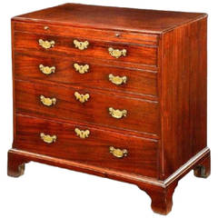 A George III mahogany chest of drawers with canted corners.