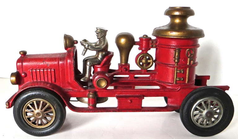Beautiful all original condition cast iron fire engine, with original nickel plated removable figure, manufactured by Hubley in Lancaster Pennsylvania, circa 1930.
There is no touch-up or repaint and no repairs. The rubber tires with metal spoke