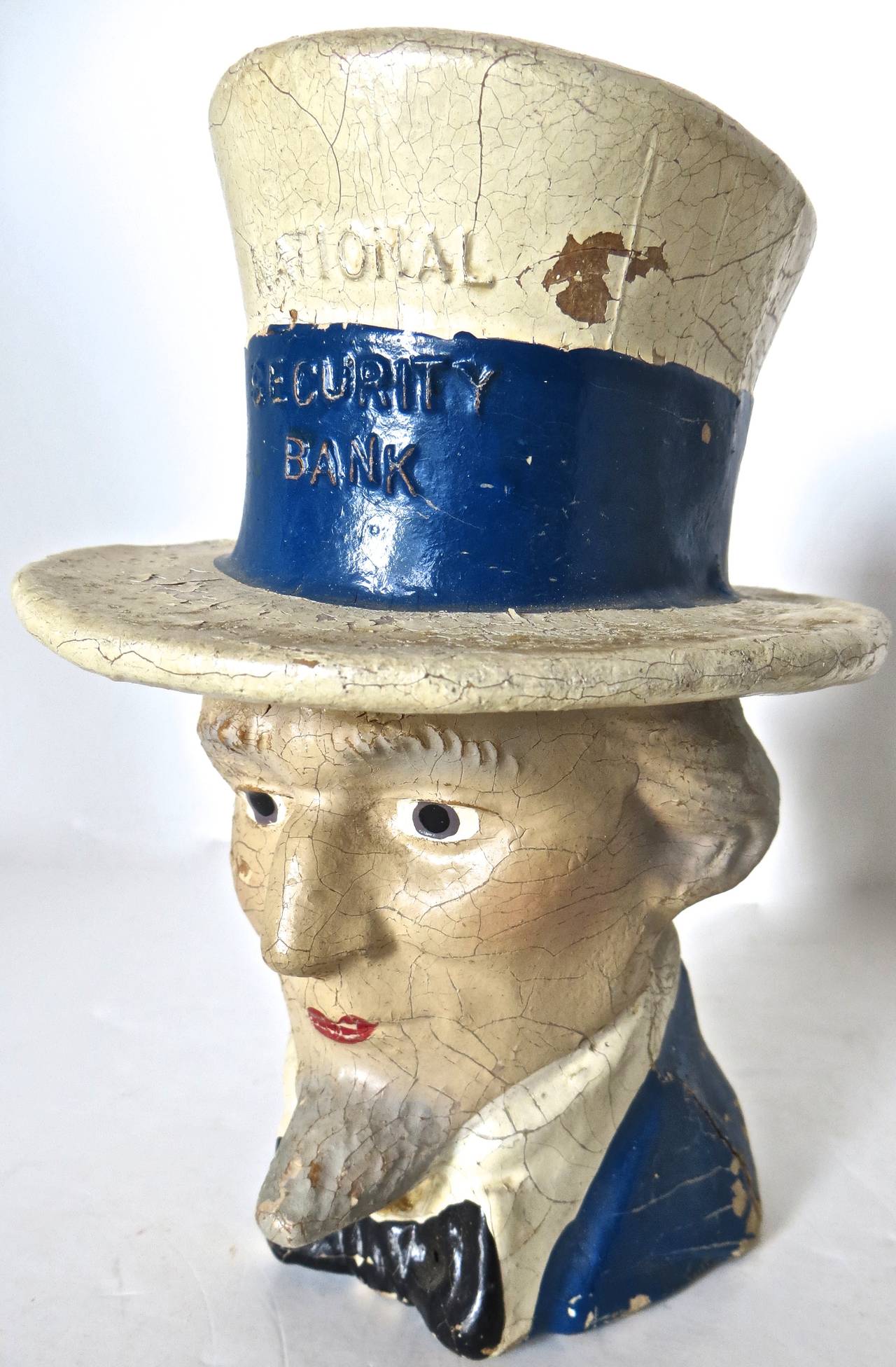 American manufacture; this colorful hand-painted still bank depicting Uncle Sam is all original with no repairs and no repaint. Fabulous crazing throughout indicative of original paint. It is quite difficult to find, especially in all original
