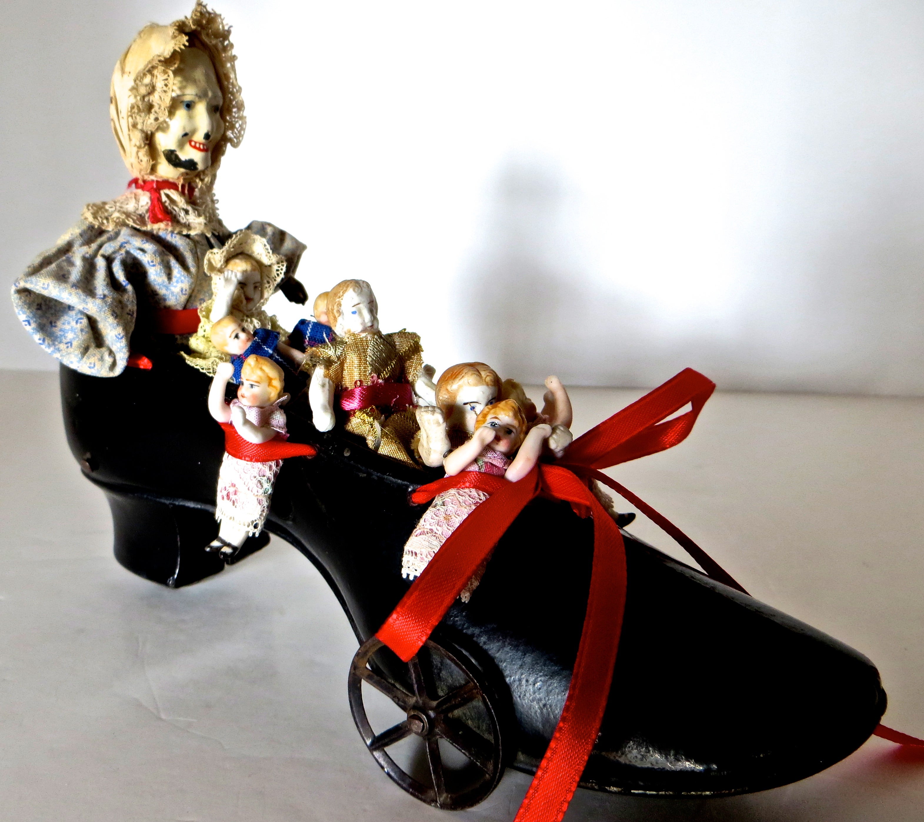 "Old Woman In The Shoe"  Pull Toy  Manufactured by Ive's, circa 1890