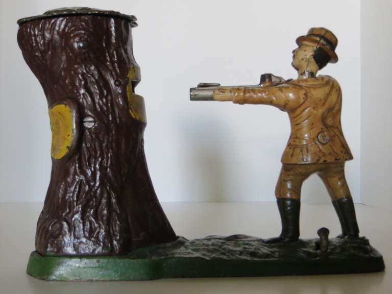 Manufactured in 1907 by the J. & E.Steven's Company in Cromwell, Connecticut, this cast iron mechanical bank measures 10 1/8