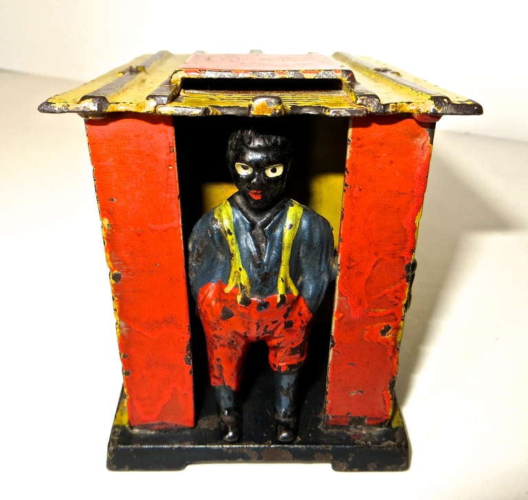 Cabin Bank, a cast iron mechanical bank, was manufactured in 1885 by the J. & E. Steven's Company located in Cromwell, Connecticut.
The action, though simplistic, is quite aggressive. Place a penny on the front of the roof;  with the man locked in