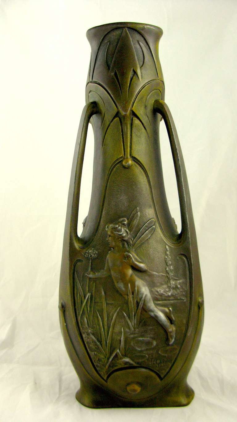 19th century Enchanted French Art Nouveau Bronze Vase by noted sculptor Jean Garnier. Three panel sides with beautiful detailed bas relief winged fairies, flora and fauna. Each panel signed by Jean Garnier (1853-1910)  Garnier was a noted French