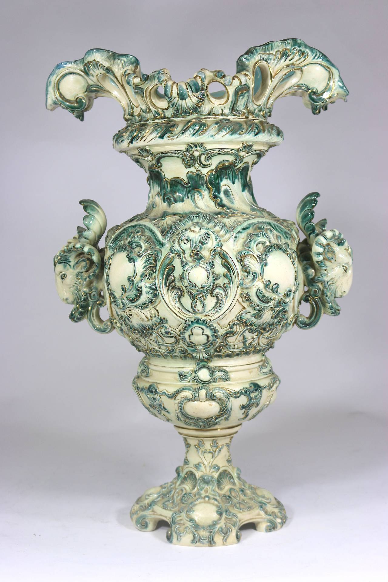 In the KPM/Meissen manner Austrian Belle Époque Large Porcelain Urn Vase with Ram’s Heads on both sides, 19th century extraordinary monumental KPM style hand-painted vase urn with fabulous rams heads, the globular body molded in high relief with