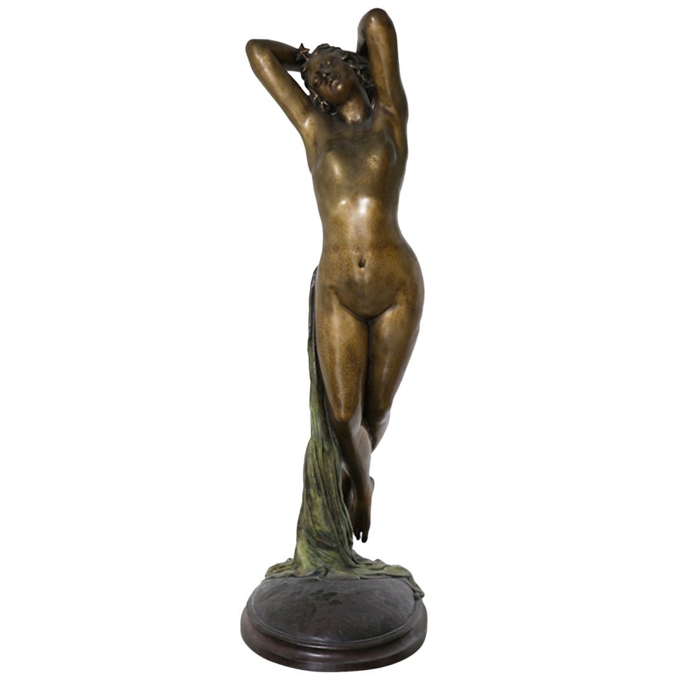 An Elegant French bronze figure of the floating sensuous Goddess Aurora with a star atop her head after Josef Michel-Ange Pollet.
19th century lovely bronze patina, green patinated bronze draped robe. This model was understandably one of the