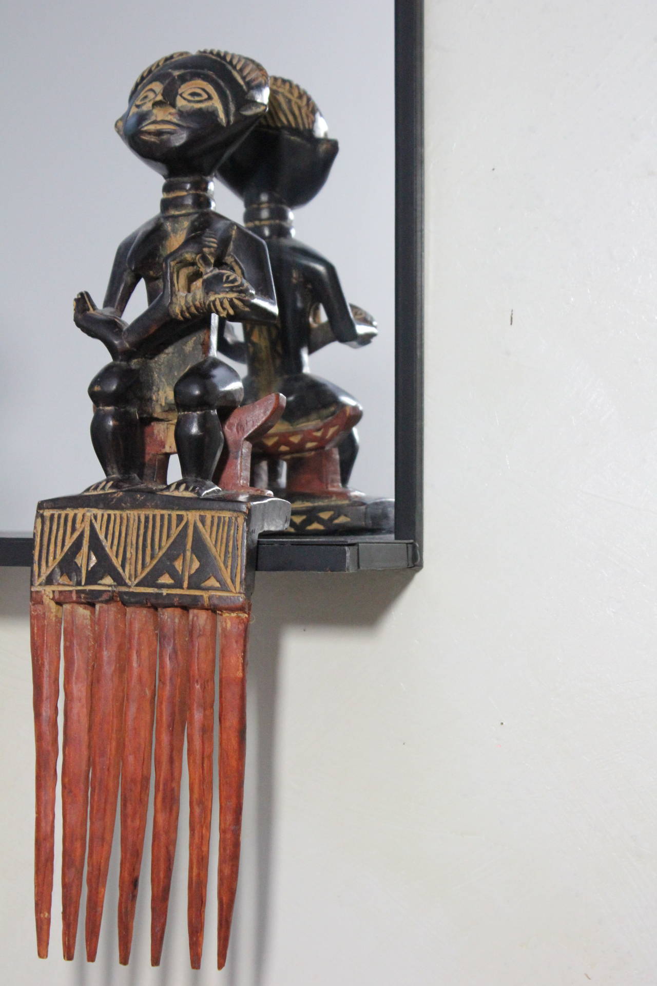 Late 20th Century Unique Steel Frame Mirror with Figural African Comb Mounts For Sale