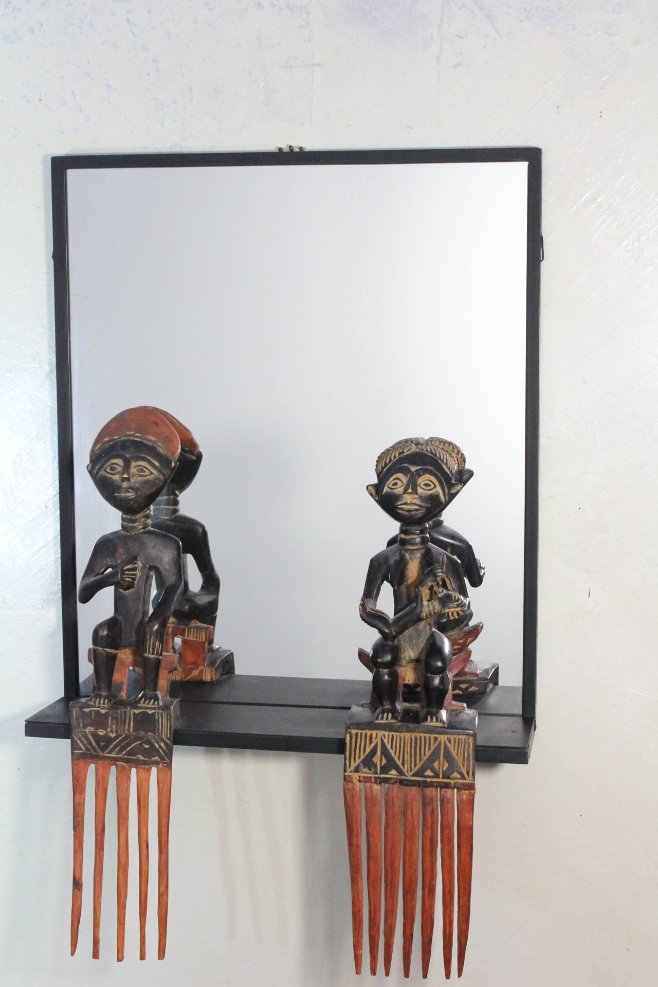 Unique Steel Frame Mirror with Figural African Comb Mounts For Sale 2