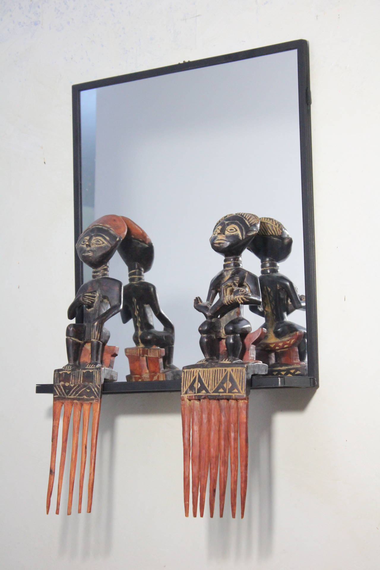 Unique Steel Frame Mirror with Figural African Comb Mounts In Good Condition For Sale In West Palm Beach, FL