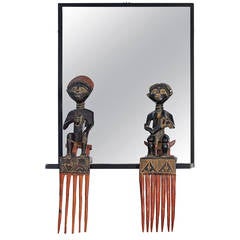 Unique Steel Frame Mirror with Figural African Comb Mounts