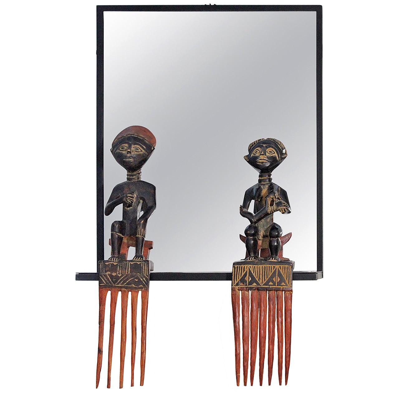 Unique Steel Frame Mirror with Figural African Comb Mounts For Sale