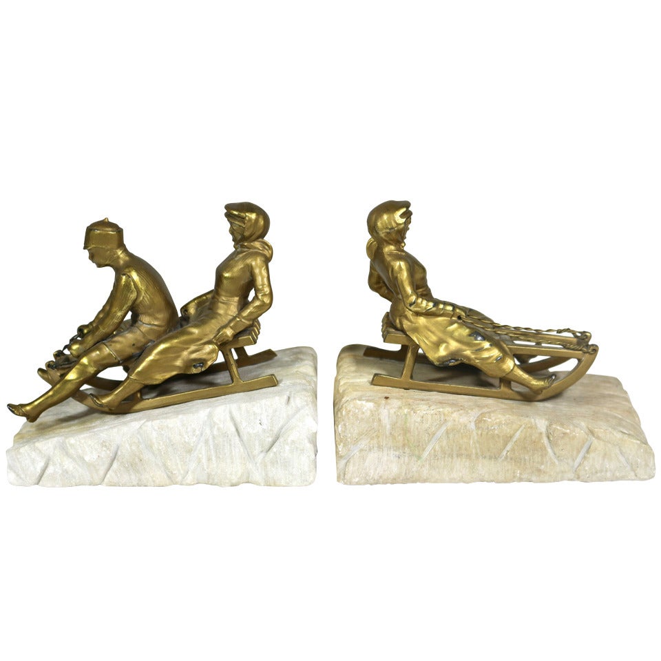 Magical Rare Art Deco Sledding Figural Bookends, Marble Carved 'Ice' Base