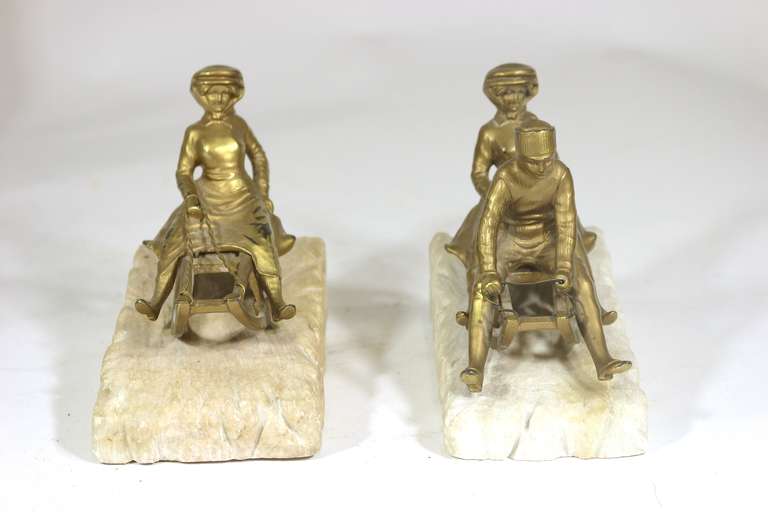 Magical Rare Art Deco Sledding Figural Bookends, Marble Carved 'Ice' Base In Good Condition In West Palm Beach, FL