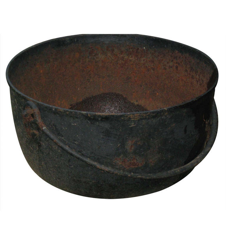 19th century large iron kettle can be used for a plant or log holder - large handle - originally used for fireplace cooking - three available.
 as