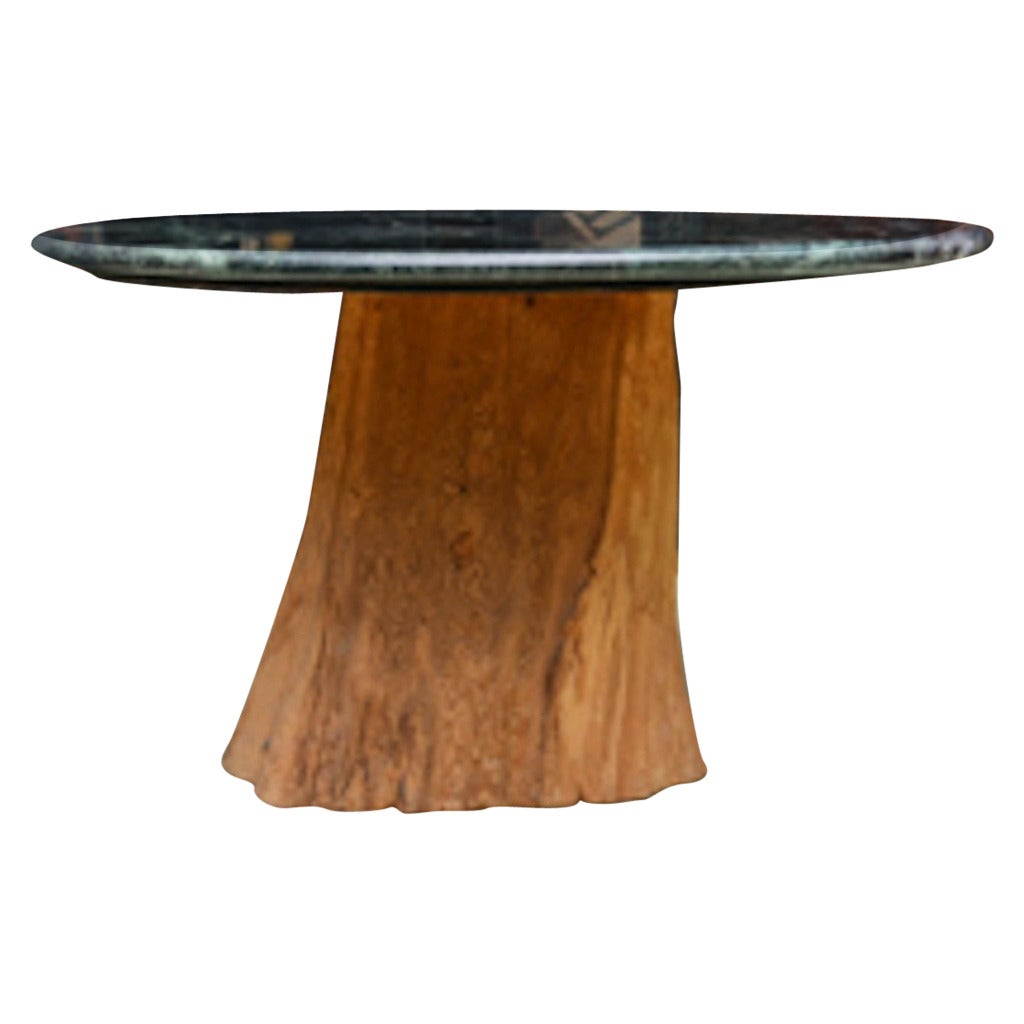 Chic Mid-Century Modern organic table by Michael Taylor designed this classic beauty. The natural sandblasted desert found wood tree trunk table from the desert of the American West. Exemplifies an early entry into organic and environmental design.