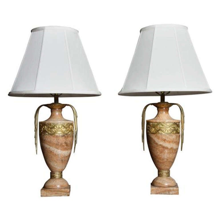 For a Connoisseur of Style and Design to Your Home!!
Superb rare Jaques-Emile Ruhlmann manner Art Deco pair of onyx urn table lamps with gilt bronze stylized geometric motif banding and curved bronze distinctively side, these will add an