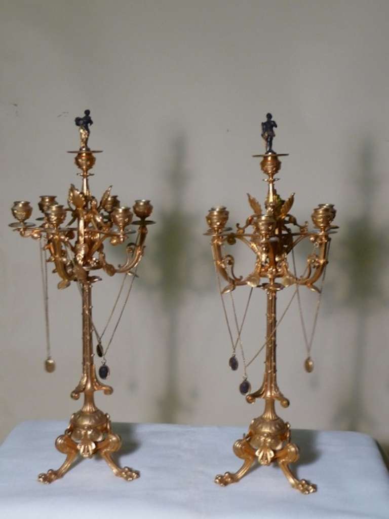 For all music and art lovers!! These are an artistic masterpiece!!
Refined circa 1830 extraordinary pair of palatial dore bronze French candelabra decorated in the center top with patinated bronze figural snuffers on one candelabra is a goddess