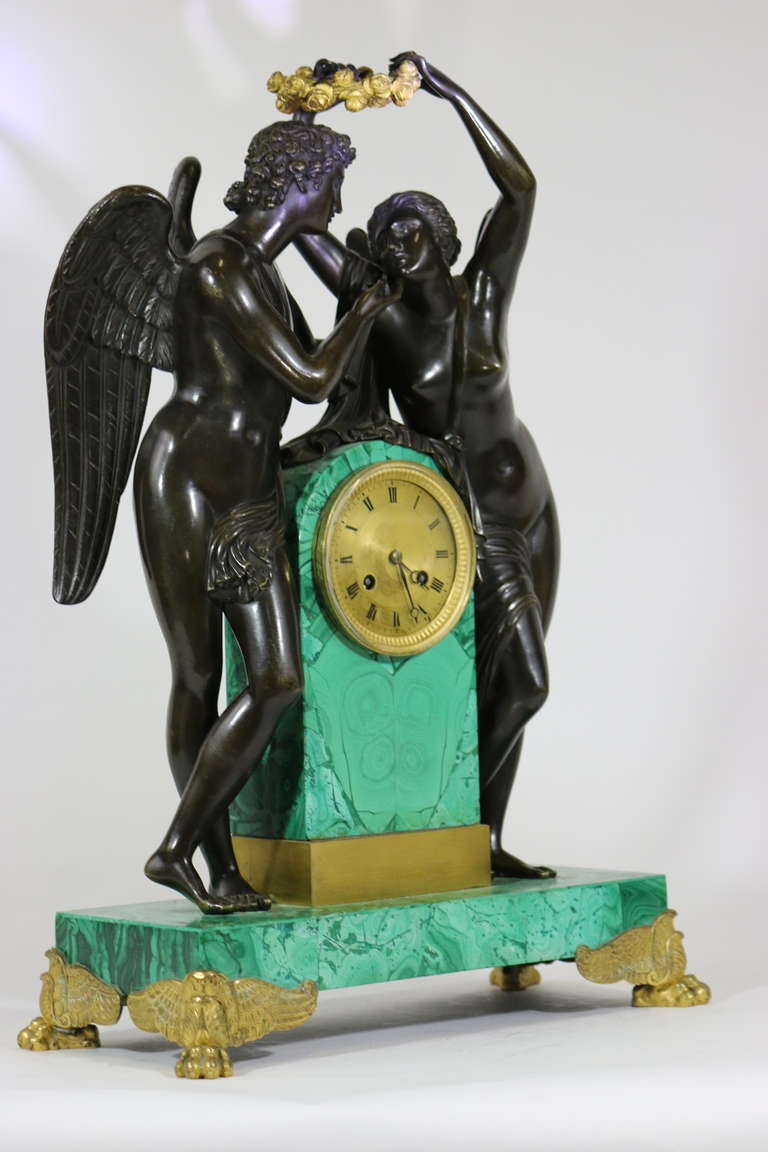 A fine important Russian bronze patinated Malachite pendulum coronation clock with a Paris movement. 'Psyche Crowning Cupid' from Greek mythology.
Featuring finely detailed patinated bronzes of winged cupid & psyche after Claude Michallon