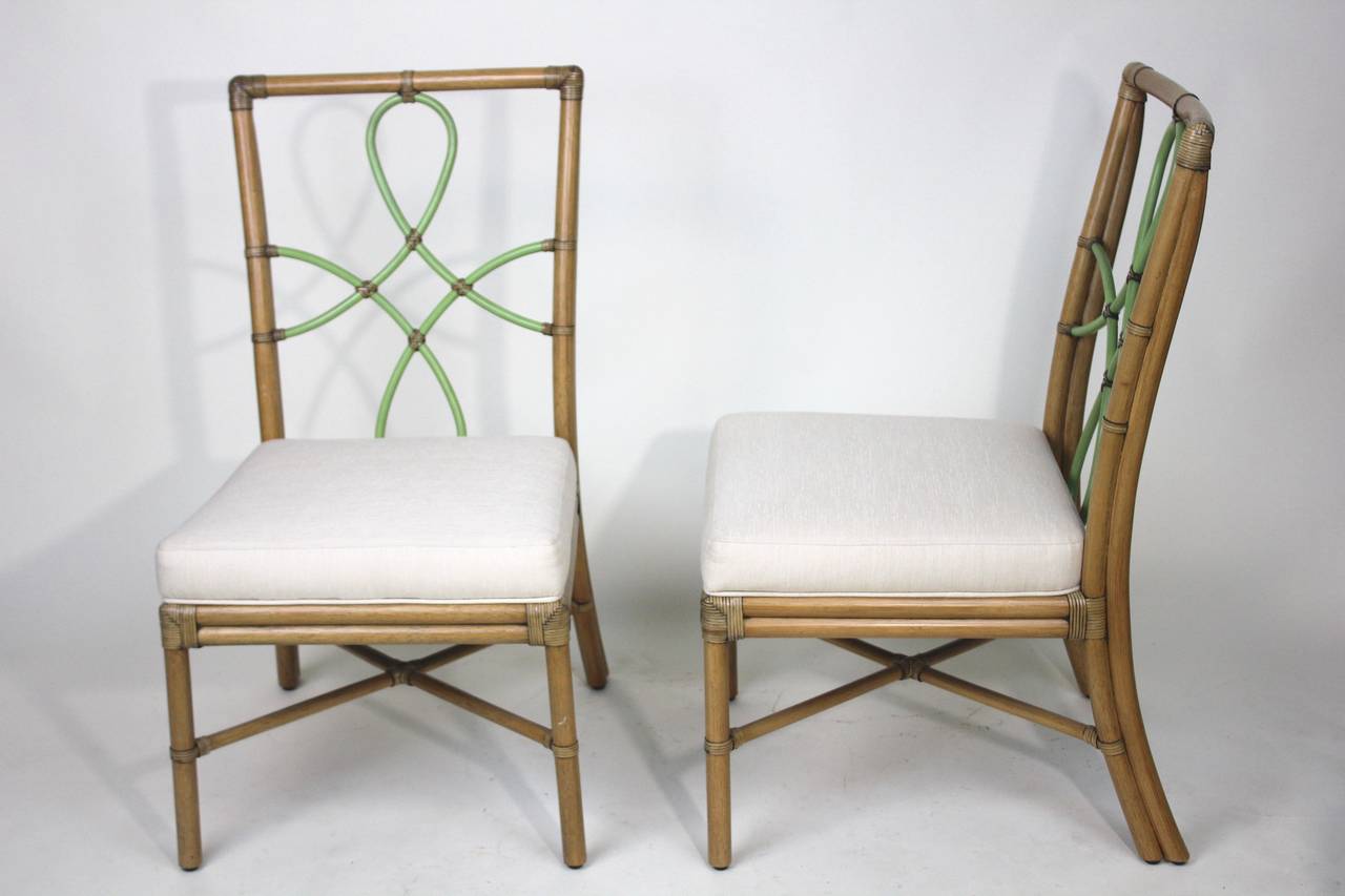 A stylish elegant vintage McGuire style pair of bamboo chairs. Like McGuire Furniture these are very well constructed- with all multi wrapped corners, an X-cross base stretcher, original beautiful curvilinear ribbon shape bamboo back with a diamond