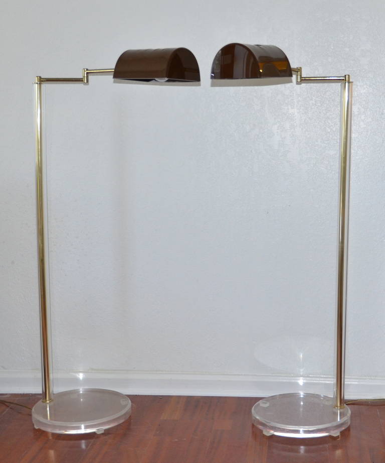 A pair of  Mid Century Modern Luxe Dimmable Lucite designer floor lamps, made to Impress!

Fabulous designer quality lamps by Bauer in the manner of Karl Springer.  Mid-Century modern pharmacy swing arm Lucite, and brass rod floor lamp-with dimmer.