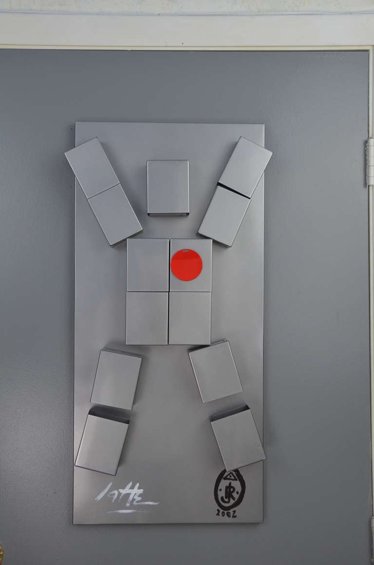'Hollowman white heart'-sculpture--contemporary artist Ronn Jaffe's iconic figure -- 14 moveable magnetic metal components on metal panel -and enamel paint.
Jaffe's work examines his continued interest in the visual, environmental and interactive