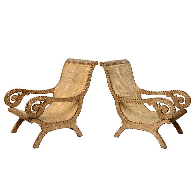 RARE PAIR OF EXQUISITE PALACE ANGLO-INDIAN PLANTATION LOUNGE CHAIRS with bone inlay design and woven cane seating were fabricated for aristocratic Indians and English Colonials during the 19th century.

Provenance-assembled from our family's
