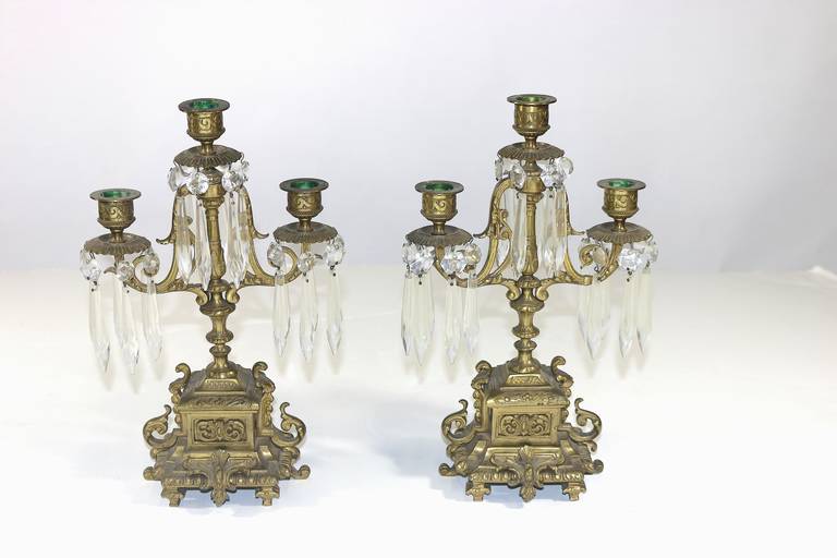 The lovely girandoles feature an elaborate repousse aged brass or bronze base, three stylized detailed arms and bobeches adorned with fine cut crystal pendants.
Provenance-assembled from our family's Maryland estate, The Edith Hale Harkness estate.
