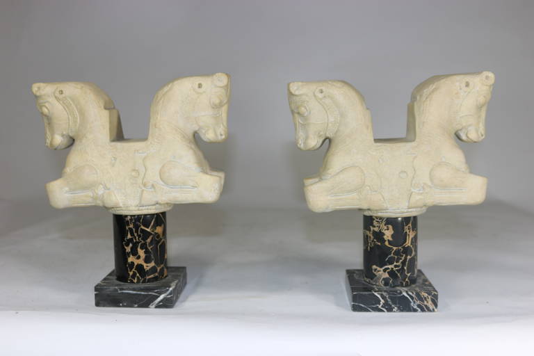 The bulls have it!!!
1950s midcentury pair of double bull Classical statues purchased from the Louvre Museum in Paris. Nicely detailed cast stone highly stylized small scale Classical Grecian reproductions of Achaemenid or First Persian Empire