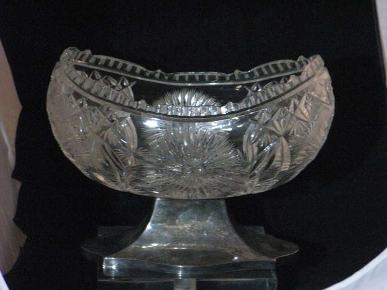 A Very Large Impressive Very Fine 19th c. Cut Crystal Baccarat Style Bowl Centerpiece with Delicate Engraved Decoration and Finely Shaped Edges Mounted in a Silver Plate Base.  
Provenance-- This was A Beautiful Center Piece for An English George