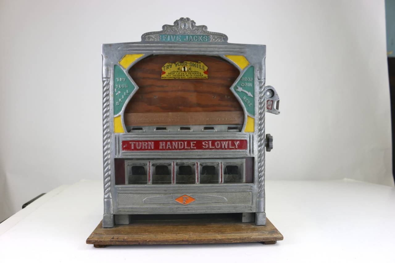 Own a rare and desired antique vintage counter top gaming gambling trade stimulator made by the Field Company, circa early 1930s.
This is a very fun game. The player inserts a penny into the slot and flicks their finger to launch the coin into the