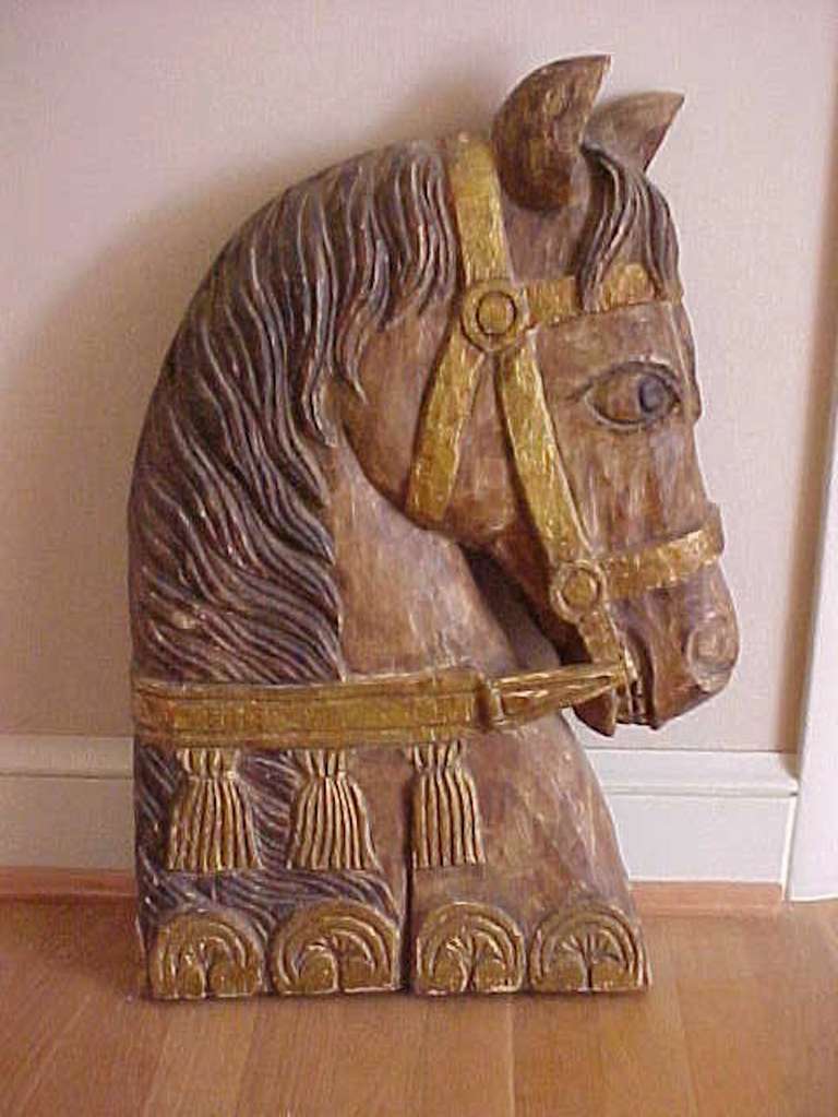 Handsome 1940-1950s vintage Mid-Century carved stylized wood horse head wall sculpture. Touches of gilt on the bridle-carved decorative tassels and Guilloche detail.
Welcome all equestrians !! 
We are a private Estate Holding Co. for our Families