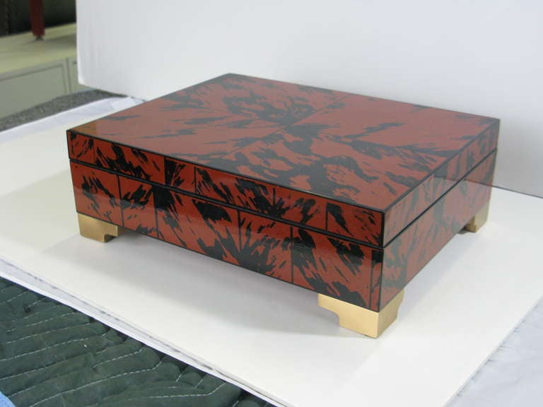 Stunning large lacquered faux tortoise box. Mid-Century Modern with brass stepped feet and black velvet padded interior.  In like new condition.
Makes a fabulous decorative box for a distinctive room!
Our world-wide holdings include thousands of