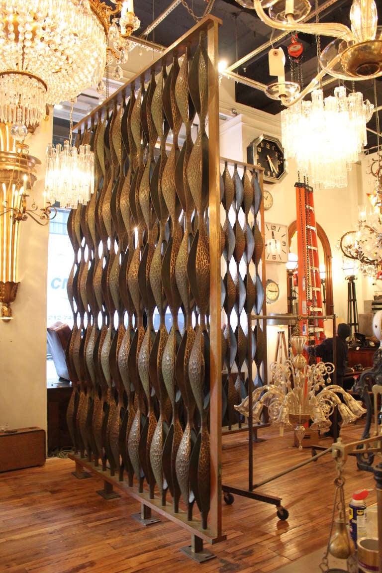 Lobby room divider from the Public Safety Building in Syracuse, NY and crafted in 1964.  This is a magnificent example of Mid-Century Modern design. Composed of alternating pod-shaped sculpted bronze components securely fastened into a solid bronze