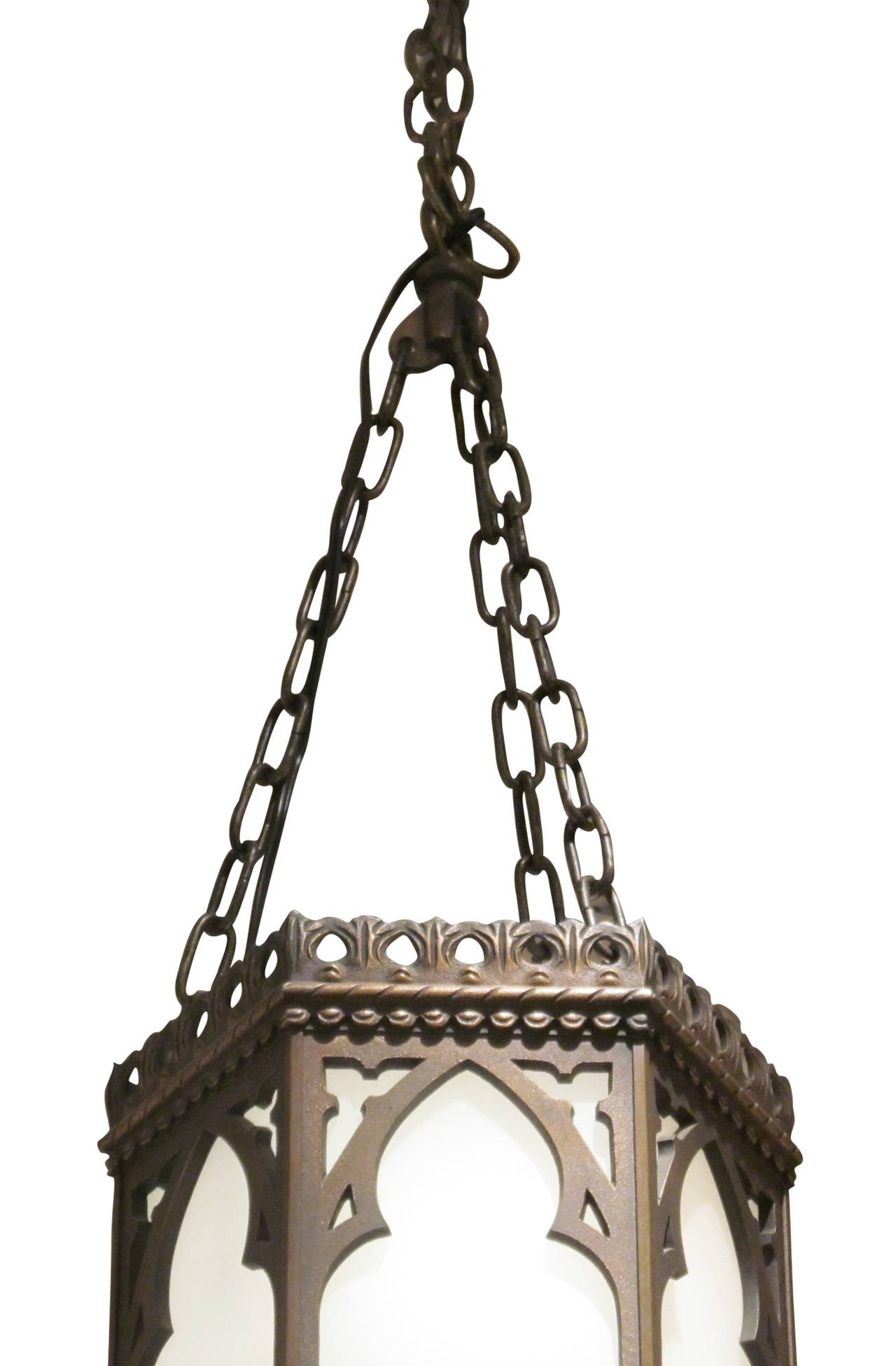 1920s large hexagon bronze Gothic lantern pendant with arches. The frame is hand-forged bronze. This light has been completely restored and rewired. At the time of posting several were available. Priced each. This item can be viewed at our 5 East