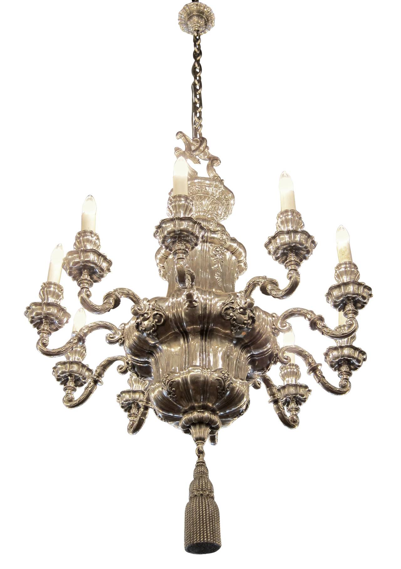 1895 silvered bronze Georgian style ten-arm chandelier by E. F. Caldwell with finely articulated tassel and well, with a massive loop in proportion to the frame. Cleaned and rewired. Please note, this item is located in one of our NYC locations.