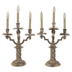 Pair of Silvered Bronze Table Candelabrum with Opposing Cherubs by E.F. Caldwell
